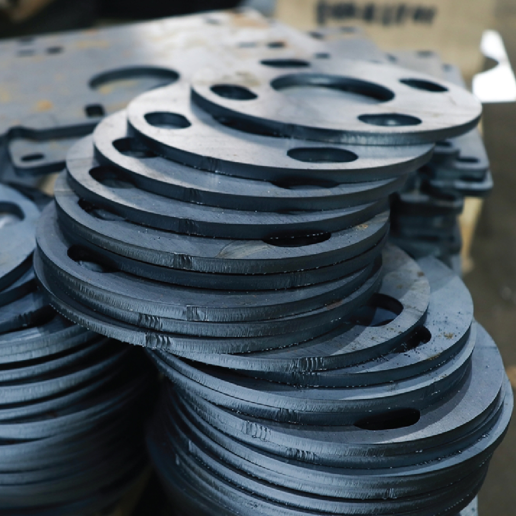 A piece of intricately designed metal that has been precisely cut using laser cutting technology, showcasing smooth edges and detailed patterns.