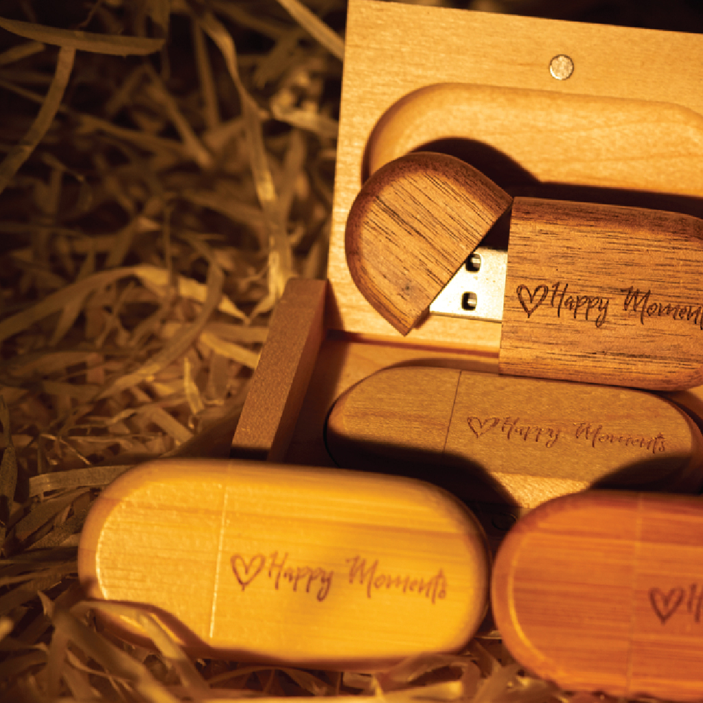 A sleek USB drive featuring custom engraving with a company logo, showcasing precise detailing and a professional finish.