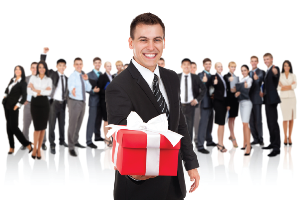 A corporate gifting session in an Abu Dhabi office, with a businessman presenting a gift to another professional. The gift is elegantly wrapped and symbolizes appreciation or celebration within the corporate environment.