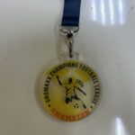 Colorful acrylic medal with UV print, featuring a motivational message, designed by Mineflow Ads. Made from high-quality, durable materials.