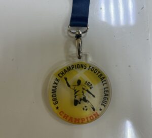 Colorful acrylic medal with UV print, featuring a motivational message, designed by Mineflow Ads. Made from high-quality, durable materials.